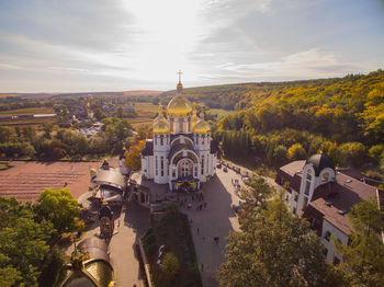 Panoramic view of temple amidst buildings against sky