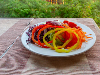 High angle view of fruit in plate on table