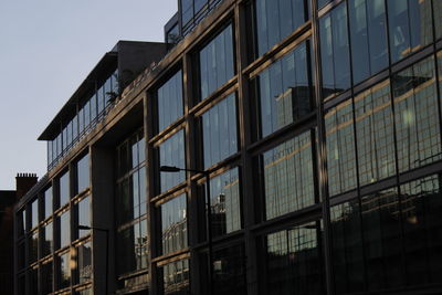 Low angle view of modern building against clear sky