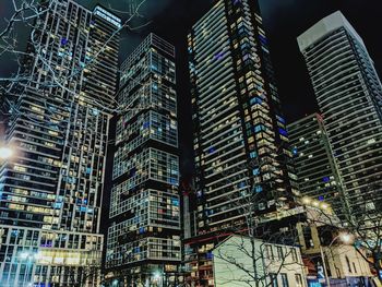 Low angle view of modern buildings at night