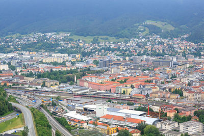 High angle view of illuminated buildings in city