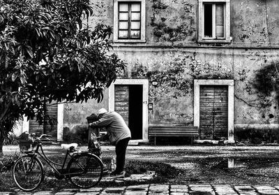 Bicycle parked in front of building