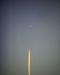 Low angle view of vapor trail against sky at night