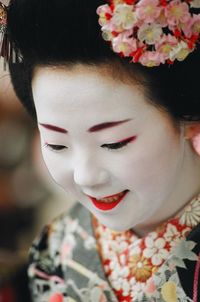 Close-up of woman holding flowers