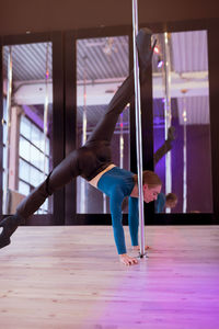 Low section of woman exercising in gym