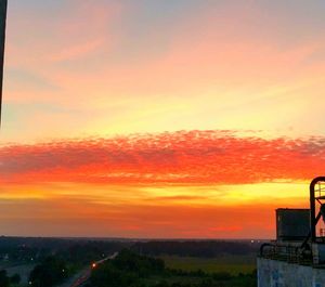 Scenic view of dramatic sky during sunset