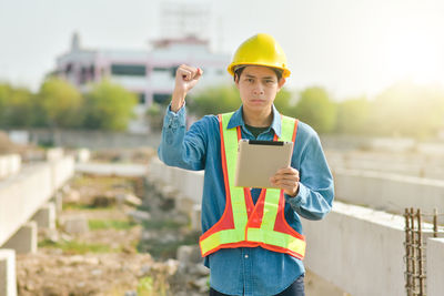 Young man working at construction site