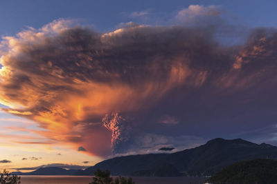 Scenic view of mountains against sky at sunset