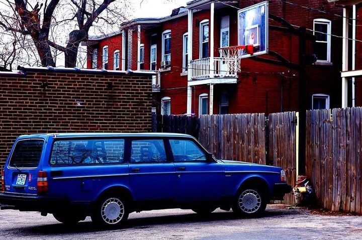 building exterior, land vehicle, transportation, architecture, car, built structure, mode of transport, street, stationary, parked, parking, city, window, bare tree, road, house, brick wall, residential building, outdoors, day