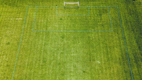 Fresh green grass is growing on the soccer fields at a local park