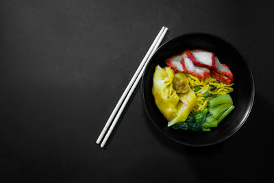 Directly above shot of vegetables on table against black background