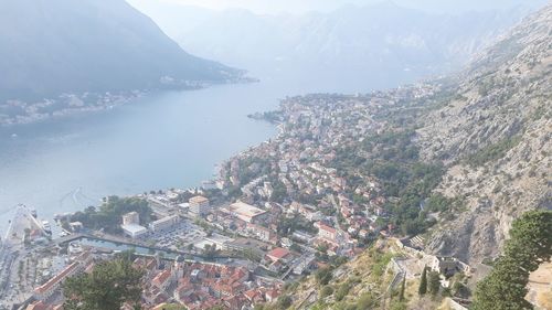 High angle view of townscape by sea