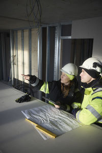 Engineers talking at building site