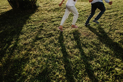 Low section of people running on field