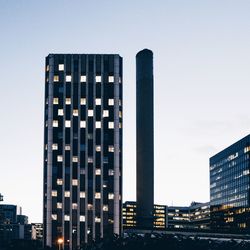 Low angle view of modern buildings against clear sky