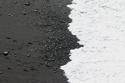 High angle view of wet sand on beach