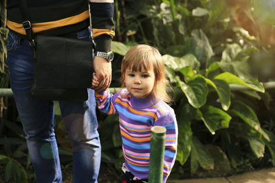 Full length of mother and daughter outdoors
