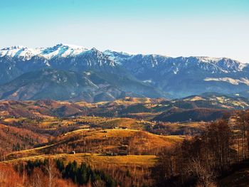 Scenic view of mountains against sky during sunset