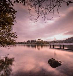 Scenic view of lake against cloudy sky