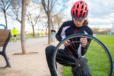 Athlete repairing tire