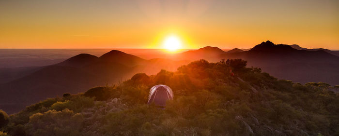 Scenic view of mountains against sky during sunset