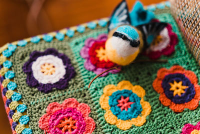 High angle view of colorful toy with fabric on table