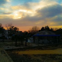 Built structure against sunset sky