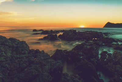 Scenic view of sea against sky during sunset