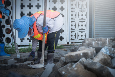 Rear view of men working