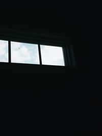 Low angle view of sky seen through window