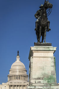 Low angle view of statue against clear sky