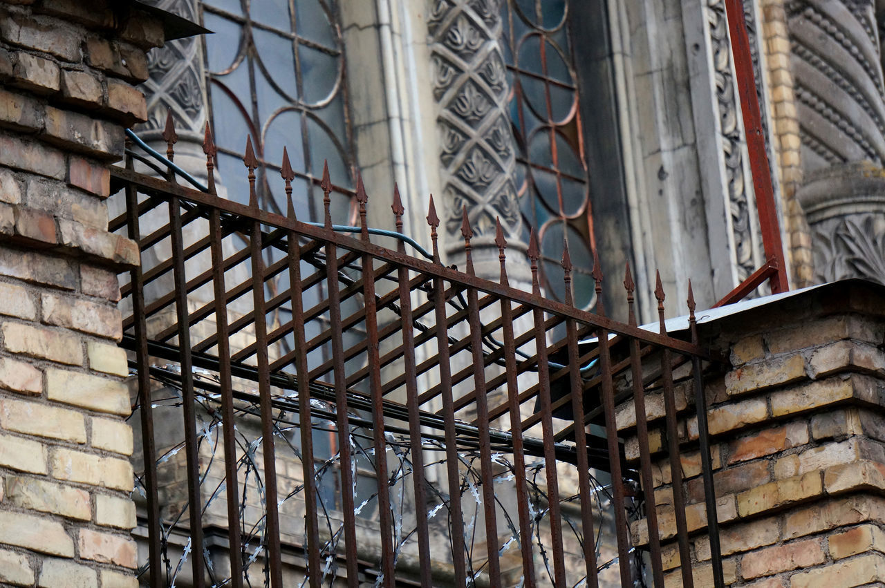 LOW ANGLE VIEW OF METAL WINDOW OF BUILDING