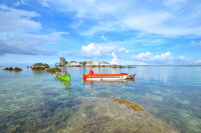 Boat in sea against sky