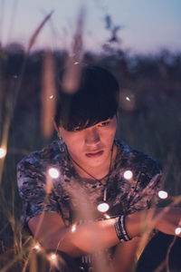 Portrait of young man in park