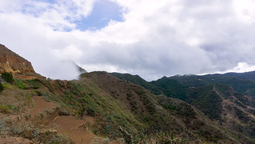 Scenic view of rocky mountains against sky