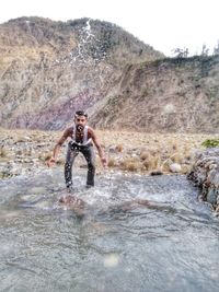 Full length of man on river