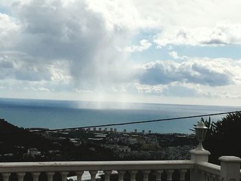 Scenic view of sea against cloudy sky