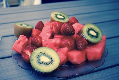 High angle view of fruits in plate on table