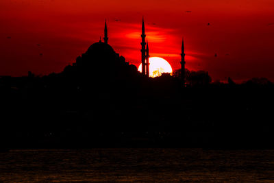 Scenic view of silhouette land against sky during sunset