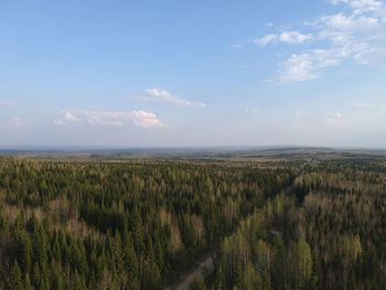 Scenic view of land and sea against sky