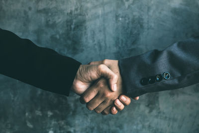 Close-up of man holding hands