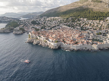 High angle view of city by sea