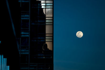 Low angle view of full moon at night