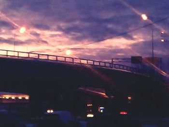 View of bridge in city at sunset