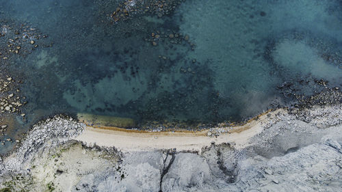 High angle view of surf on shore