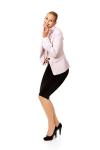 Portrait of woman wearing hat against white background