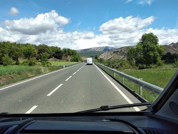 Road seen through car windshield