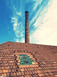 Low angle view of smoke stack against sky