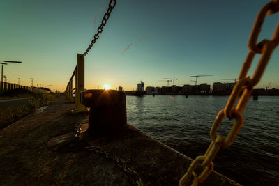 View of harbor against sky during sunset