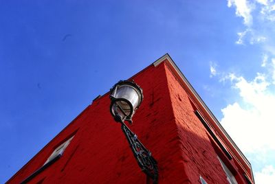 Low angle view of old building against blue sky
